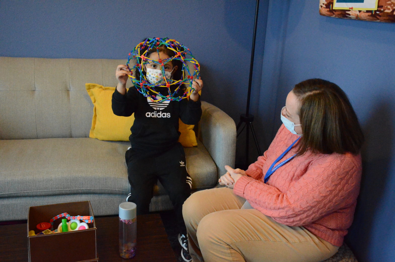 Chelle Osara puts a child at ease during her appointment